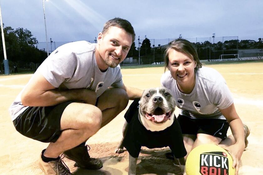 Andy and Kelly Smisek, founders of Frosted Faces Foundation, with Frosted Faces Mos in preparation for the Kick It for K9s tournament on Nov. 6.