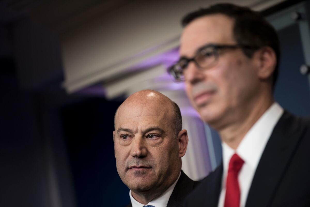 National Economic Director Gary Cohn, left, accompanied by Treasury Secretary Steve Mnuchin, speaks Wednesday in the White House briefing room, where they discussed President Trump's tax proposals.