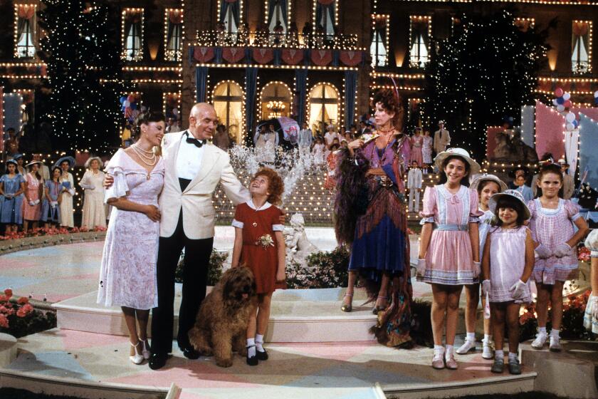 Albert Finney, Aileen Quinn, Carol Burnett and others on stage in scene from the film 'Annie', 1982. (Photo by Columbia Pictures/Getty Images)