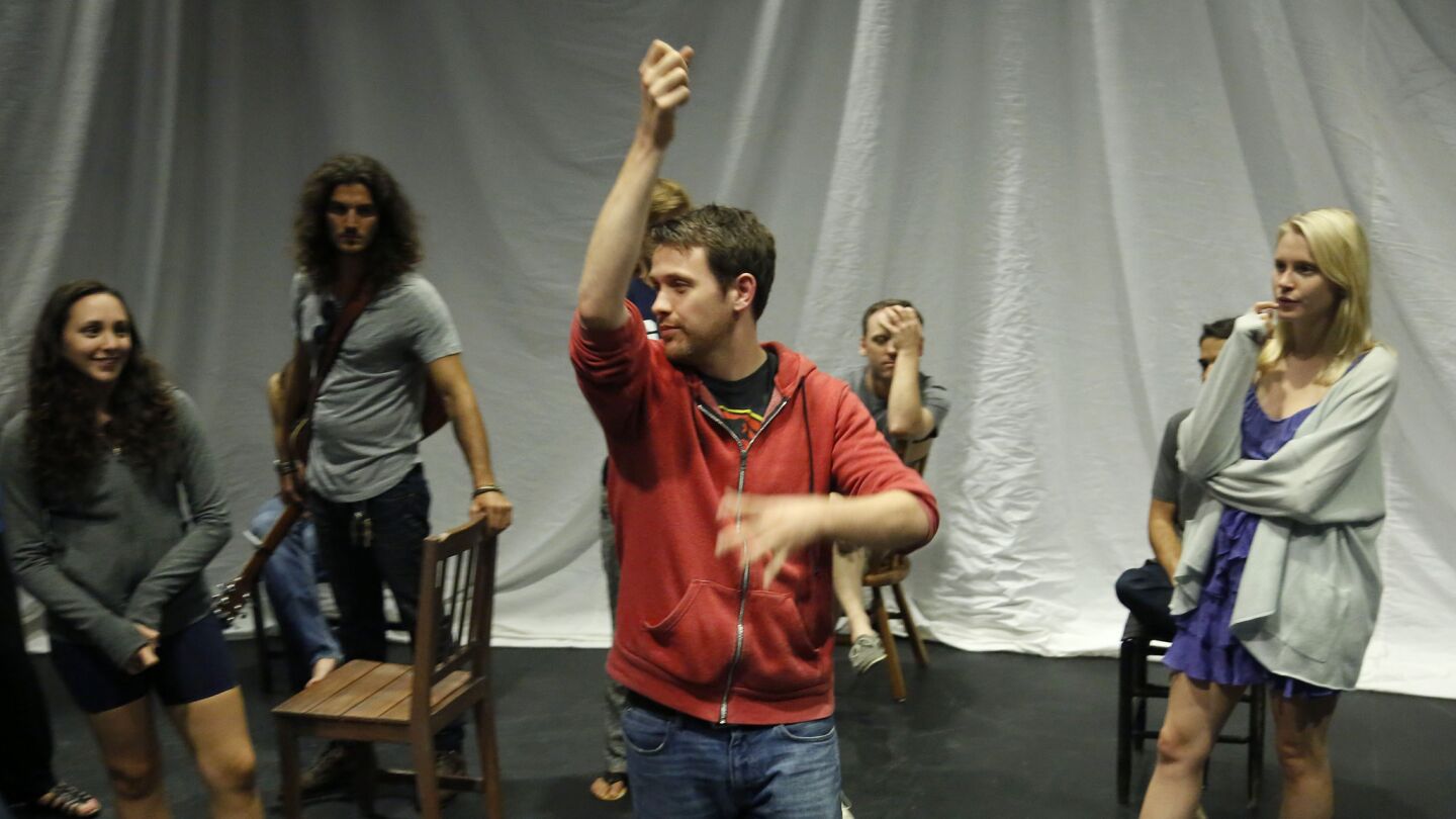 Director Michael Arden works with the cast.