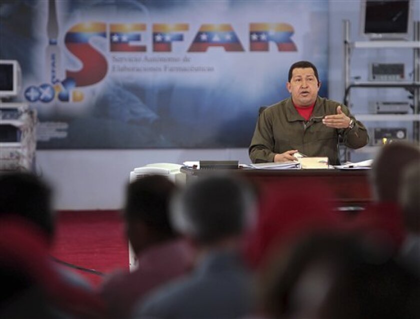 In this photo provided by Miraflores Press Office, Venezuela's President Hugo Chavez speaks during his TV show "Hello President" in Caracas, Sunday, May 3, 2009. Chavez announced Sunday that 18 Venezuelan soldiers died in a helicopter crash near Venezuela's border with Colombia while on patrol. Gen. Domingo Alberto Feneite was among the victims. (AP Photo/Miraflores Press Office)