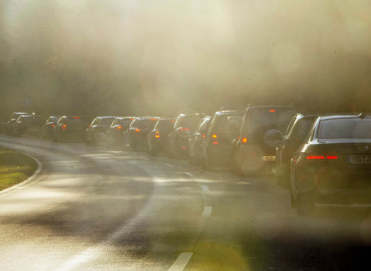 FILE-In this Oct. 31, 2018 file photo people queue in a traffic jam when commuting to Frankfurt, Germany. The European Union's top court ruled Thursday that Germany “systematically and persistently" exceeded limits on nitrogen dioxide, a harmful gas produced by diesel engines, in many regions between 2010 and 2016.(AP Photo/Michael Probst, file)