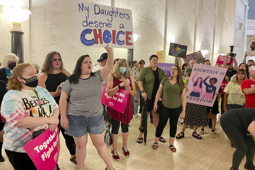 FILE - Abortion rights protesters chant outside the West Virginia Senate chambers prior to a vote on an abortion bill, July 29, 2022, in Charleston, W.Va. An abortion provider filed a lawsuit on Wednesday, Feb 1, 2023, seeking to overturn West Virginia's near-total ban, saying it is unconstitutional, irrational and causes irreparable harm to the state's only abortion clinic and its patients. (AP Photo/John Raby, File)