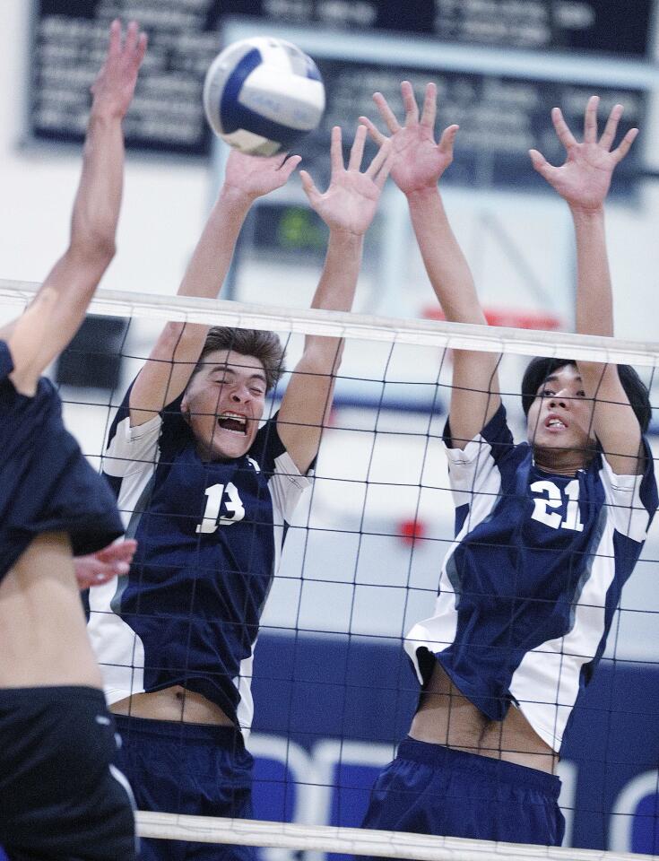 Flintridge Prep's Luke Stiles and Torres Shi reach to block a kill by Godinez in CIF Southern Section Division IV first-round playoff match at Flintridge Preparatory School on Tuesday, April 30, 2019. Flintridge Prep swept Godinez 3-0.
