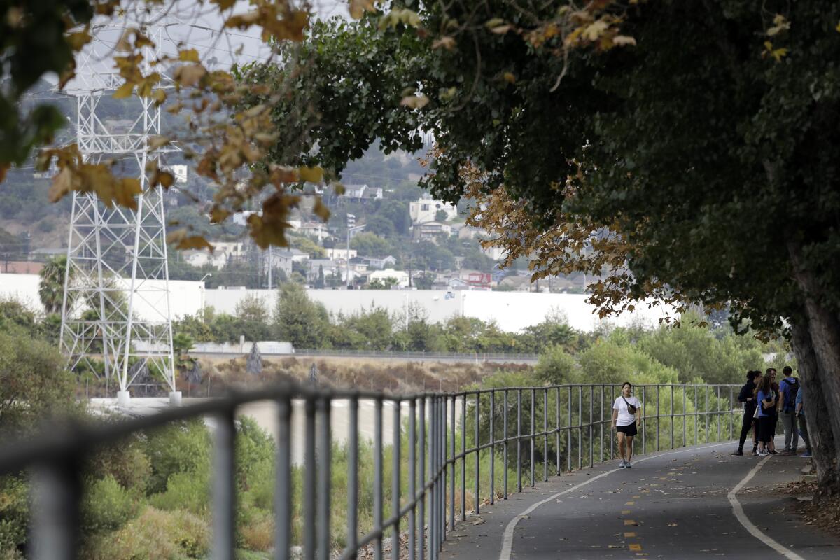 Pedestrians walk along the Los Angeles River Bike Path near Glassell Park and Atwater Village.