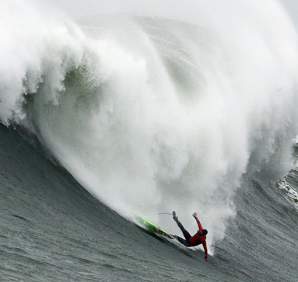 Jamie Mitchell wipes out on a giant wave during the finals of the Titans of Mavericks surfing contest in Half Moon Bay, Calif. Nic Lamb won the title.