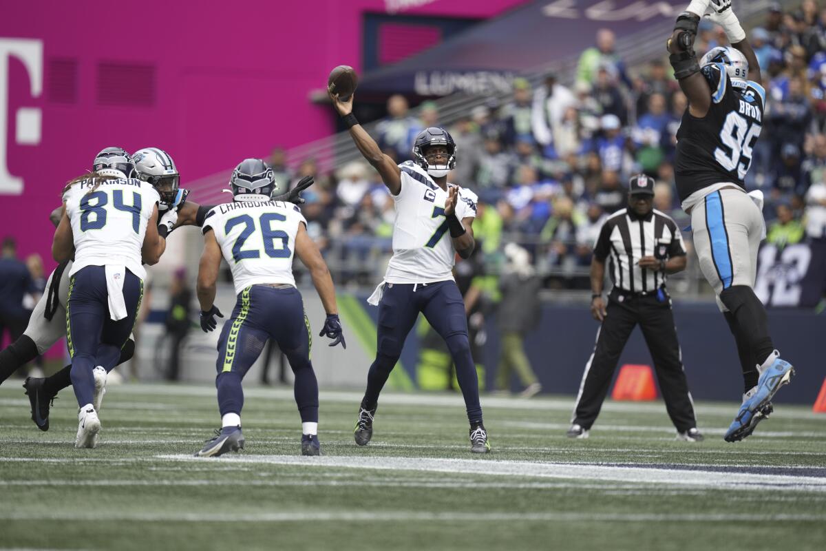 Seattle Seahawks quarterback Geno Smith passes the ball.