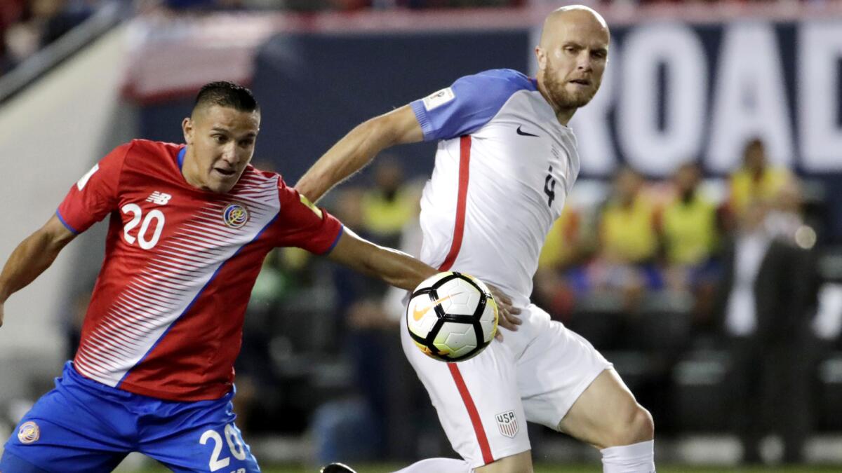 U.S. midfielder Michael Bradley, right, and Costa Rican midfielder David Guzman battle for control of the ball during Friday's game.