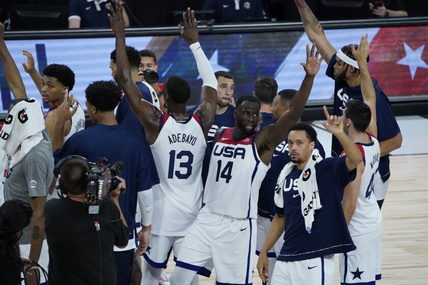 United States players celebrate after defeating Spain in an exhibition basketball game in preparation for the Olympics, Sunday, July 18, 2021, in Las Vegas. (AP Photo/John Locher)