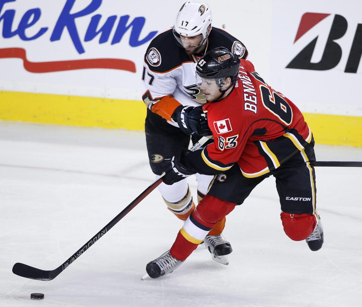 Ducks center Ryan Kesler and Flames center Sam Bennett battle for the puck during the first period of Game 3.