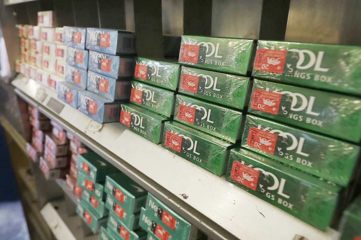 FILE - Menthol cigarettes and other tobacco products are displayed at a store in San Francisco on May 17, 2018. Cigarette manufacturer ITG Brands assumed liability for tobacco settlement payments to the state of Florida when it acquired four brands from Reynolds American in 2015, a Delaware judge has ruled Friday, Sept. 30, 2022. Reynolds sold the Kool, Winston, Salem and Maverick brands to ITG in 2014 to gain federal regulators' approval of Reynolds’ acquisition of Lorillard Inc. (AP Photo/Jeff Chiu, File)