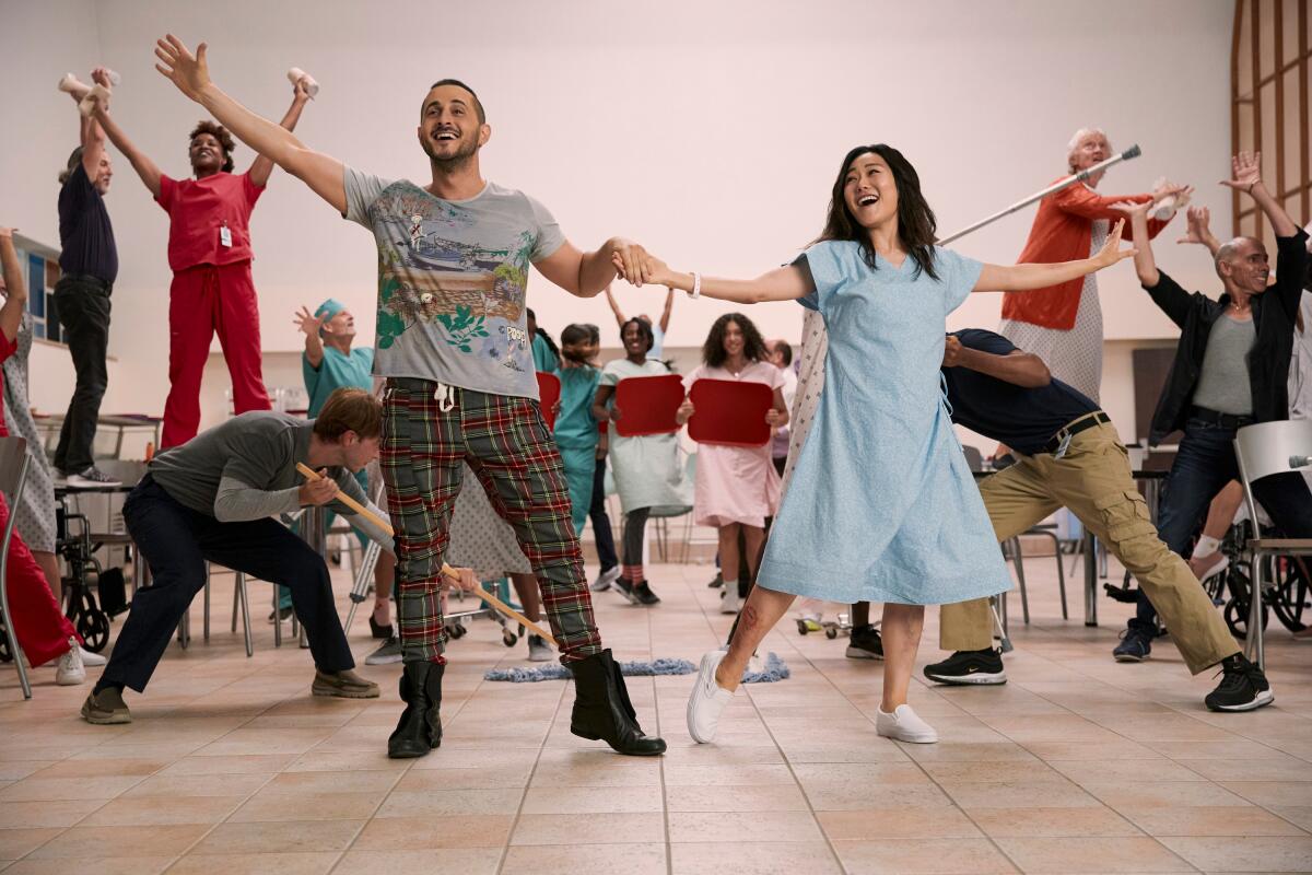 A man and a woman lead a musical number set in a hospital in "The Boys."