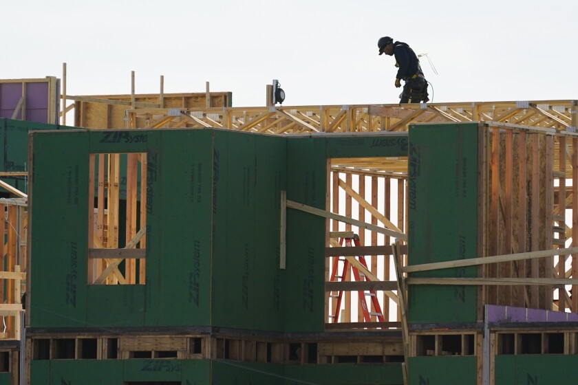 New home construction in Philadelphia, Pa., Wednesday, Nov. 17, 2021. New home construction in the U.S. jumped 11.8% in November as builder confidence continues to rise amid strong demand. The double-digit percentage increase last month left home construction at a seasonally adjusted annual rate of 1.68 million units, an 8.3% increase from the rate at this time last year, the Commerce Department reported Thursday, Dec. 16. (AP Photo/Matt Rourke)
