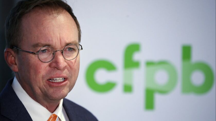 Interim Consumer Financial Protection Bureau director Mick Mulvaney is seen at a news conference in November 2017.