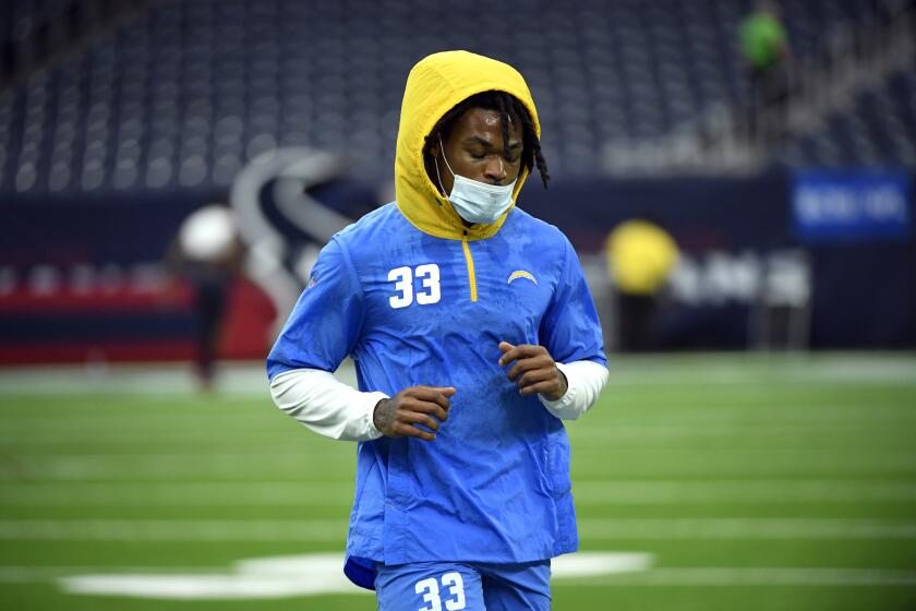 Los Angeles Chargers free safety Derwin James Jr. (33) warms up before an NFL football game against the Houston Texans Sunday, Dec. 26, 2021, in Houston. (AP Photo/Justin Rex)