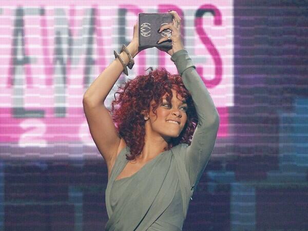 Singer Rihanna lifts award