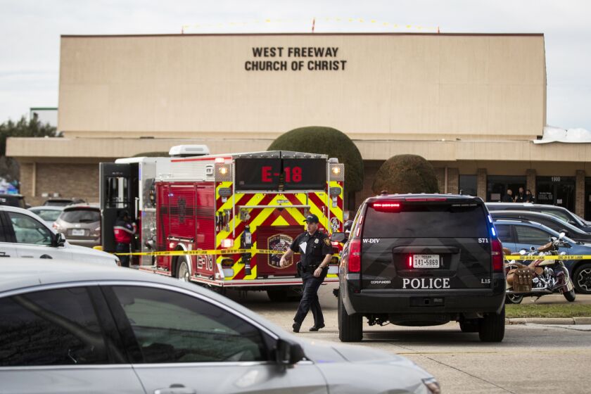 Police and fire departments surround the scene of a shooting at West Freeway Church of Christ in White Settlement, Texas, Sunday, Dec. 29, 2019. (Yffy Yossifor/Star-Telegram via AP)