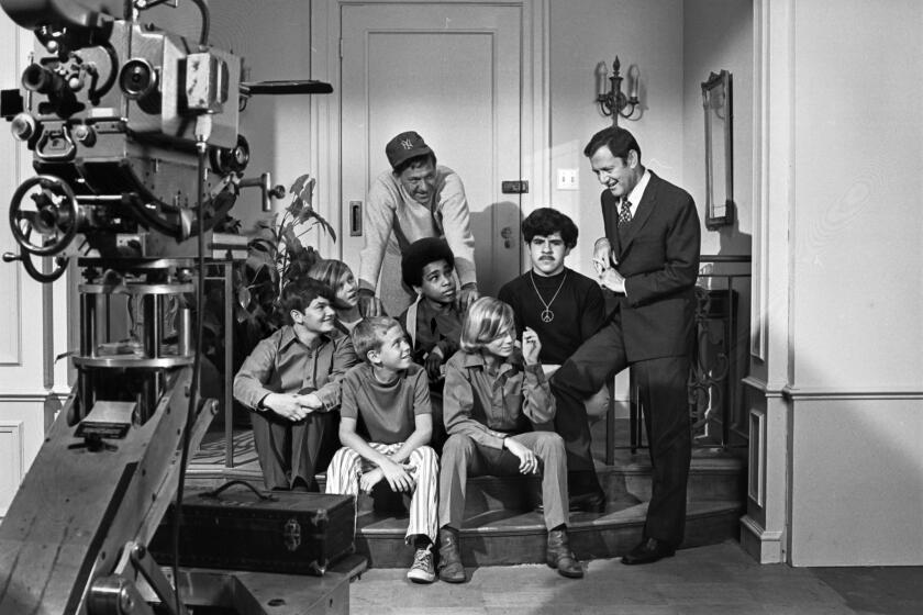 August, 1970: BROTHERLY GROUP--Jack Klugman, wearing baseball cap, and Tony Randall play host to "little brother" members of Big Brothers of America during their visit to the Paramount set of The Odd Couple, which stars Klugman and Randall. Little brothers are (front row from left): Greg Waring, Vince Carroll and Dave Warner. Back row: Steve Taranda, Ray Dodson and George Romero. This image appeared in the Aug. 13, 1970, Los Angeles Times. This photo is from the Los Angeles Times Archive at UCLA.