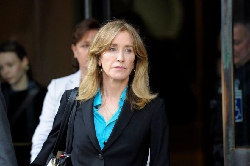 Actress Felicity Huffman exits the courthouse after facing charges for allegedly conspiring to commit mail fraud and other charges in the college admissions scandal at the John Joseph Moakley United States Courthouse in Boston on April 3, 2019. (Photo by Joseph Prezioso / AFP)JOSEPH PREZIOSO/AFP/Getty Images ** OUTS - ELSENT, FPG, CM - OUTS * NM, PH, VA if sourced by CT, LA or MoD **