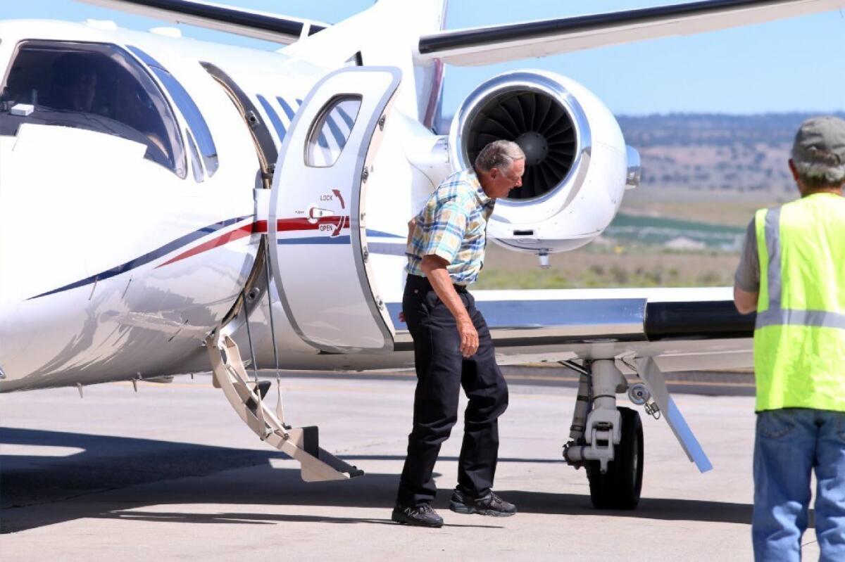 Dwight Hammond arrives at the Burns Municipal Airport in Burns, Ore., on Wednesday.