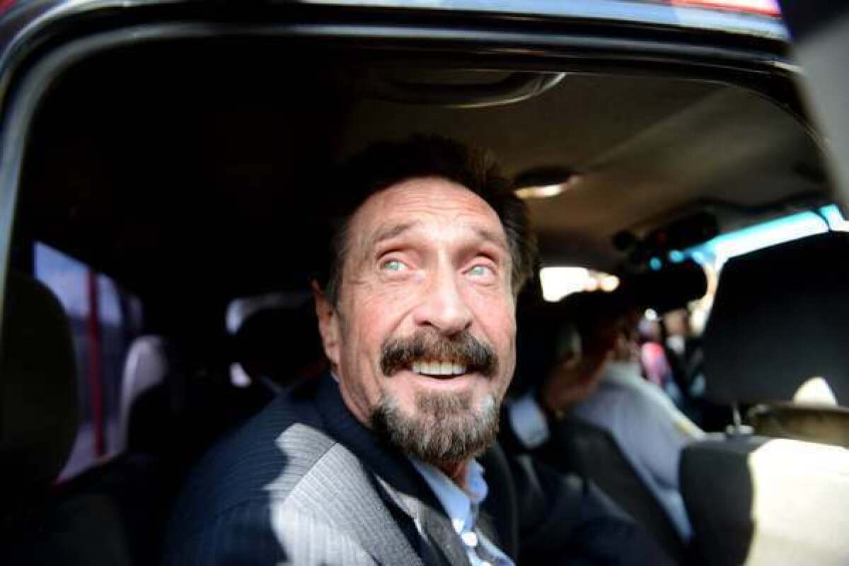 Anti-virus software pioneer John McAfee arrives at La Aurora International Airport in Guatemala City on Wednesday. McAfee avoided deportation to Belize when Guatemala decided to expel the American back to the United States instead.