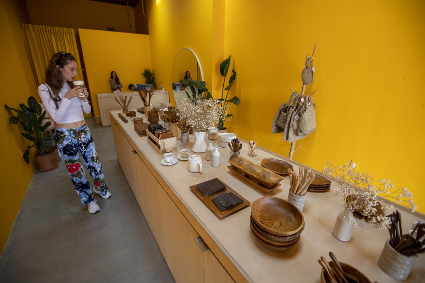 An interior view of Goodies, where the claim is “Nothing over $25." You'll find wooden bowls, ceramics, spoons and baskets on display.