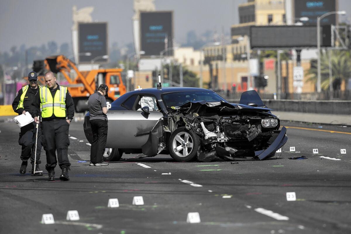 Authorities say a Dodge Charger was racing a Dodge Challenger on the southbound lanes of the 5 Freeway on Feb. 27 when the Challenger lost control and slammed into a UPS truck. Three people died at the scene and four others were injured. The Challenger driver was arrested on suspicion of vehicular manslaughter.