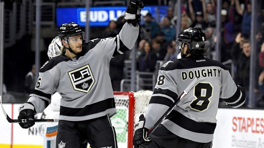 Kings defenseman Drew Doughty is congratulated by center Nic Dowd after scoring against the Sharks during the second period Saturday night.