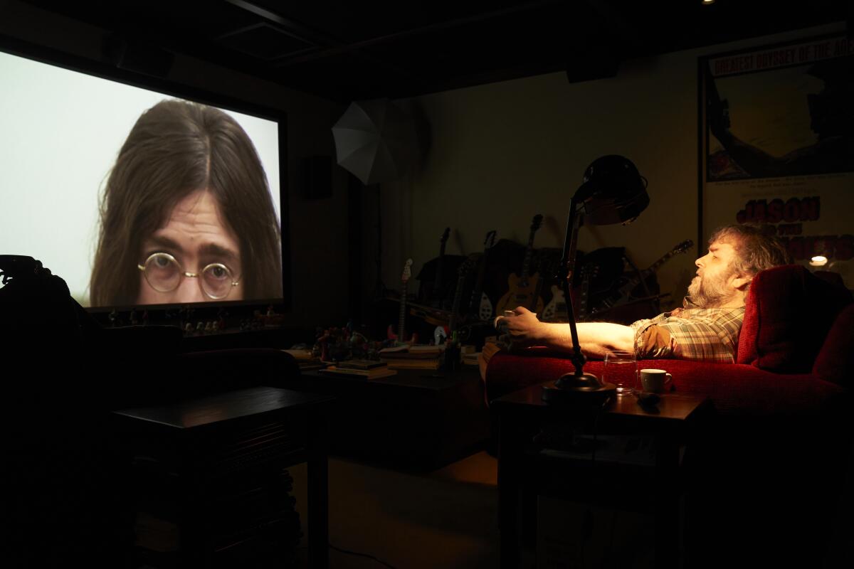 Director Peter Jackson watches footage from his film "The Beatles: Get Back."