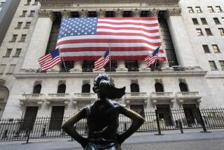 The Fearless Girl statue stands in front of the New York Stock Exchange, Monday, March 16, 2020 in New York. The U.S. stock market plunged to its worst day in more than three decades as voices from Wall Street to the White House said the coronavirus may be dragging the economy into a recession. (AP Photo/Mark Lennihan)