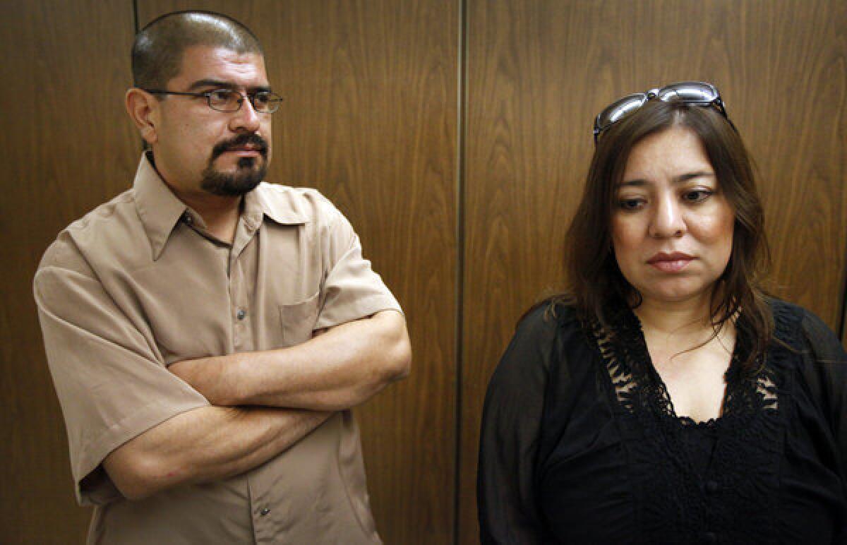 Sergio Marcial Sr., left, whose son and brother were among those killed, and Maribel Marcial, right, an aunt and sister to the victims of the 49th Street Massacre, react after Charles Ray Smith was sentenced to death.