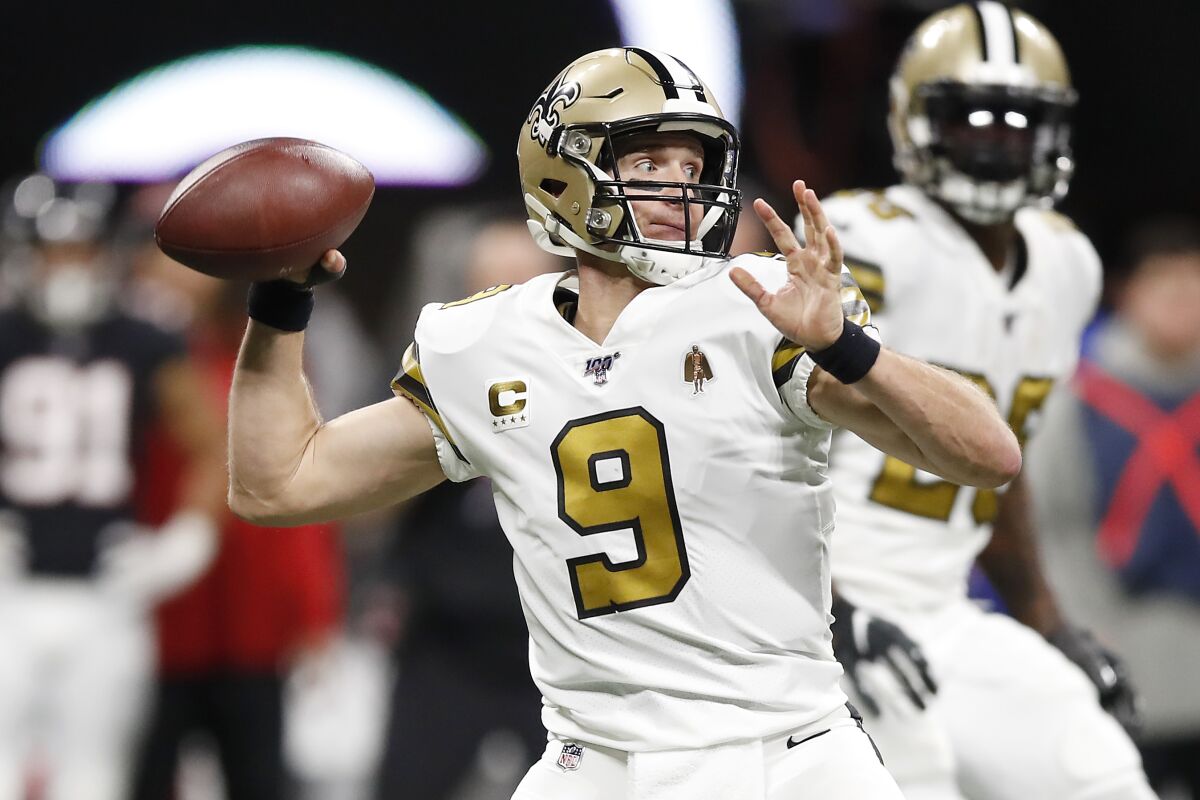 New Orleans Saints quarterback Drew Brees throws a pass against the Atlanta Falcons during the third quarter on Nov. 28 in Atlanta.