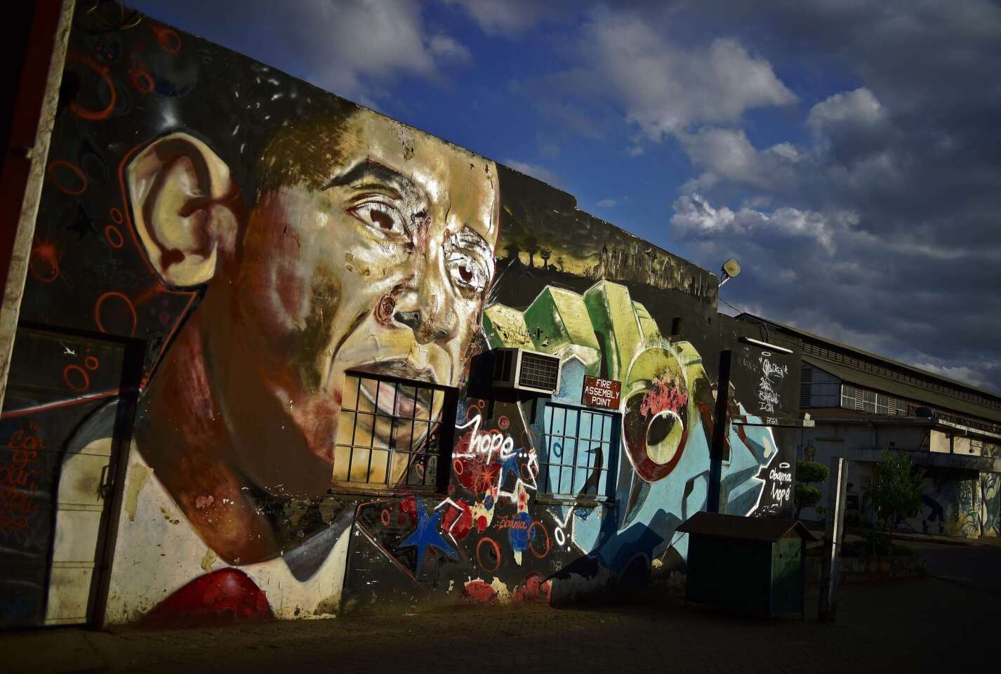A grafitti of President Obama is seen on a wall in Nairobi, Kenya on Saturday, July 25, 2015.
