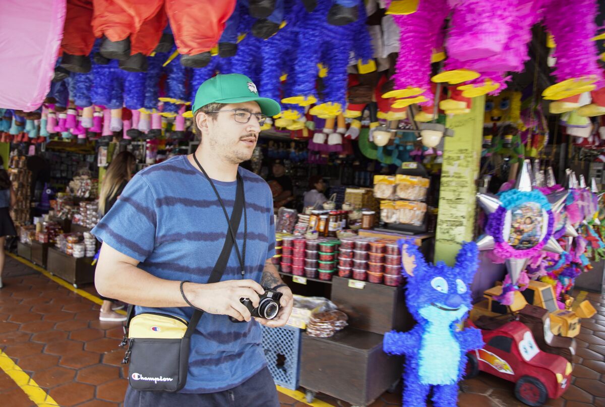 Trevor Deglopper captures some stills in Mercado Hidalgo in Zona Rio on Saturday, Aug. 13, 2022 in Tijuana, Baja California.