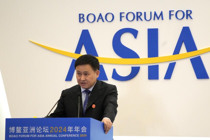 Pan Gongsheng, Governor of People's Bank of China, speaks at a sub forum ahead of the annual Boao Forum held in Boao in southern China's Hainan province on Wednesday, March 27, 2024. China's central bank governor calls for accleration of reforms on quta allocation at IMF to increase the voice of Asia (AP Photo/Olivia Zhang)