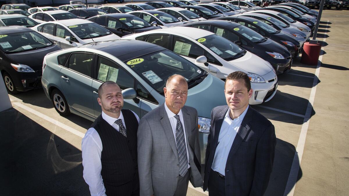 Toyota of Claremont refused to sell these Priuses because it believes a power system defect makes them unsafe. From left are Roger Hogan Jr., general sales manager at Toyota San Juan Capistrano, owner Roger Hogan, and Stephen Hogan, general manager at Toyota of Claremont.