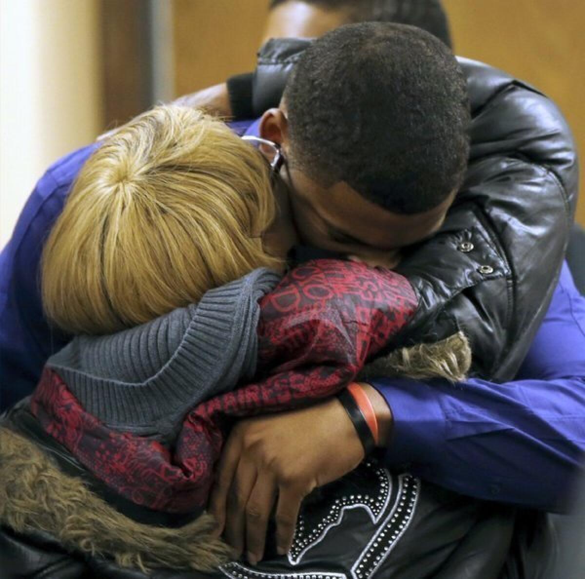 Ma'lik Richmond, top, hugs his mother, Daphne Birden, after closing arguments in the rape trial of Richmond and Trent Mays in Steubenville, Ohio.