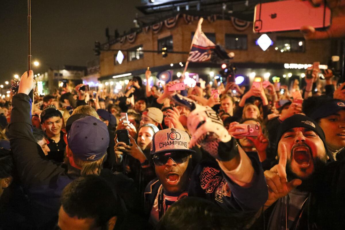 Fans cheer outside Wrigley Field after the Chicago Cubs defeated the Cleveland Indians in Game 7 to win the World Series on Nov. 3, 2016.
