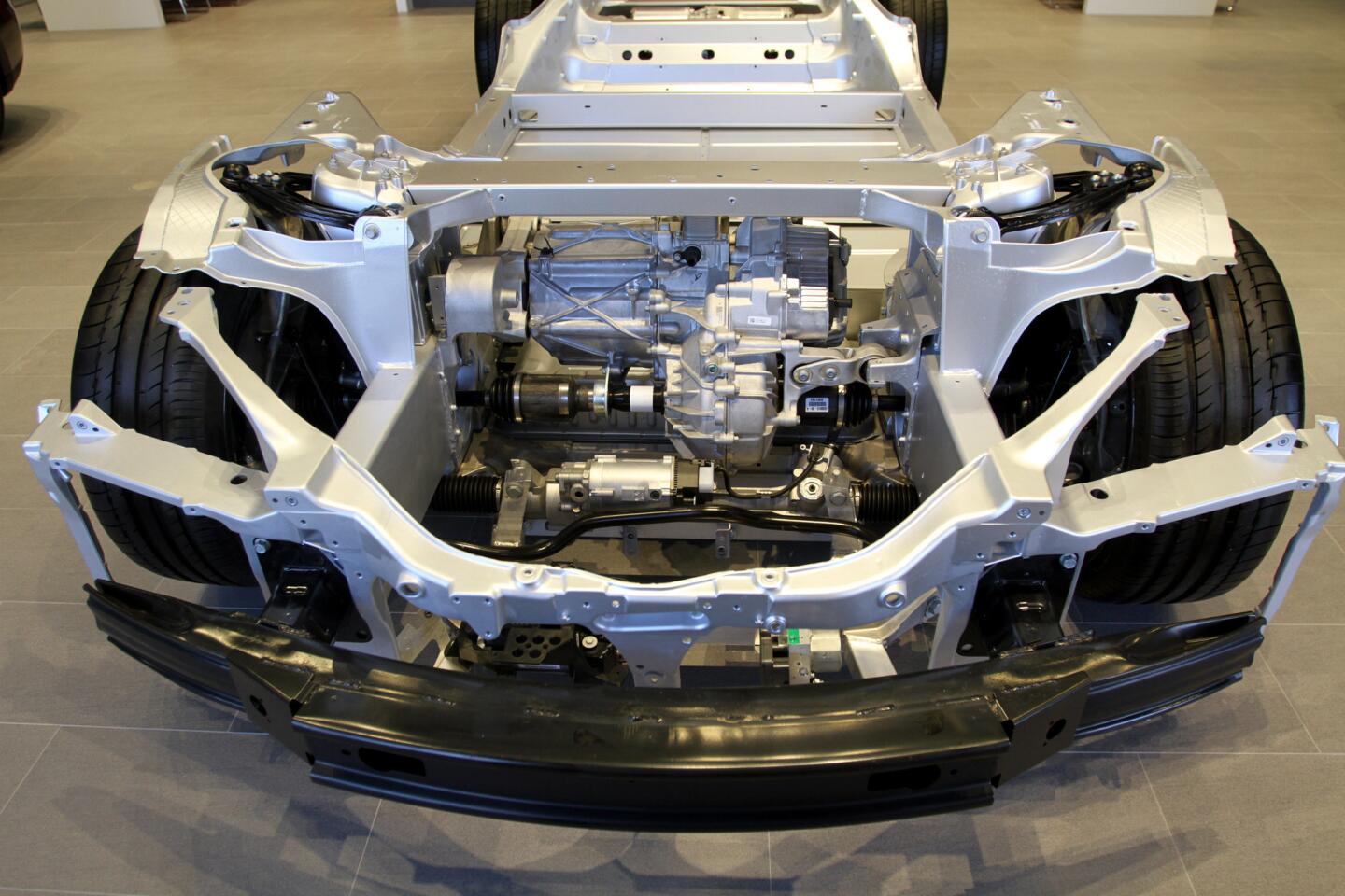 The frame and inner workings of the electric vehicles can be seen at the new Tesla Motors show room and service center which opened today, on San Fernando Rd. in Burbank on Friday, October 23, 2015. The showroom, where a customer can order their own personalized Tesla electric vehicle, will soon have a customer lounge and charging stations.