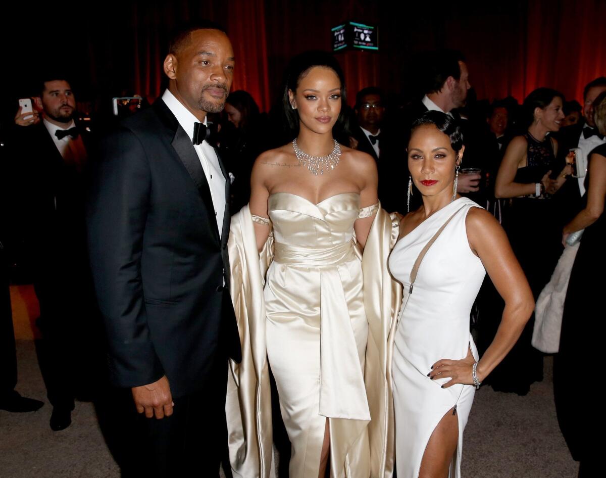 Actor Will Smith, left, recording artist Rihanna and actress Jada Pinkett Smith attend the second annual Diamond Ball.