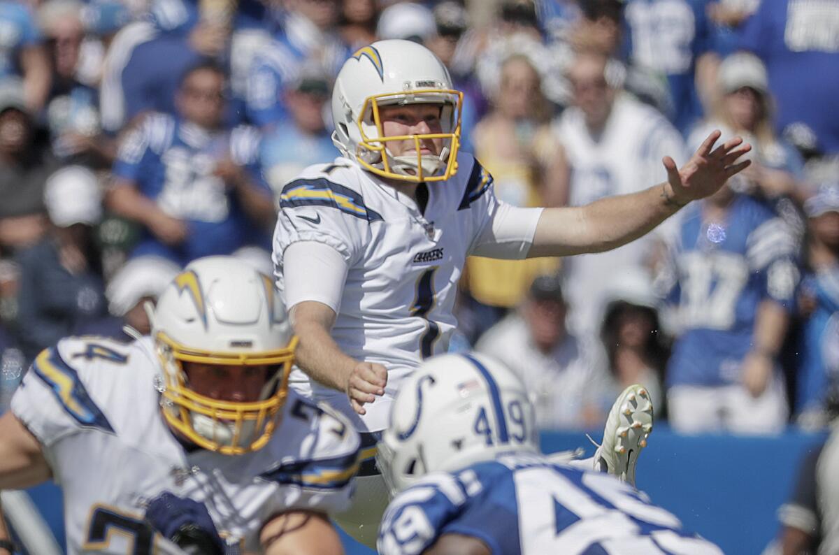 Chargers punter Ty Long follows through on a second-half punt against the Colts on Sunday.