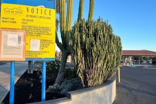 A sign outside the closed Motel 6 on Mar Vista Drive gives notice of its planned conversion into an SRO.