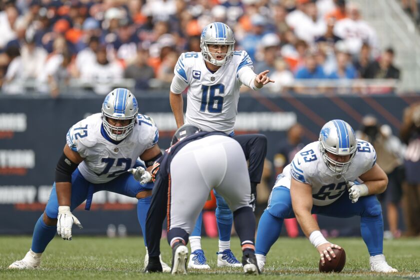 Detroit Lions quarterback Jared Goff (16) yells as he waits for the ball from center Evan Brown (63) during the second half of an NFL football game against the Chicago Bears, Sunday, Oct. 3, 2021, in Chicago. (AP Photo/Kamil Krzaczynski)