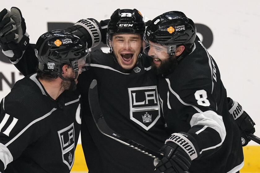 Los Angeles Kings right wing Dustin Brown, center, celebrates his goal agains the Minnesota Wild.