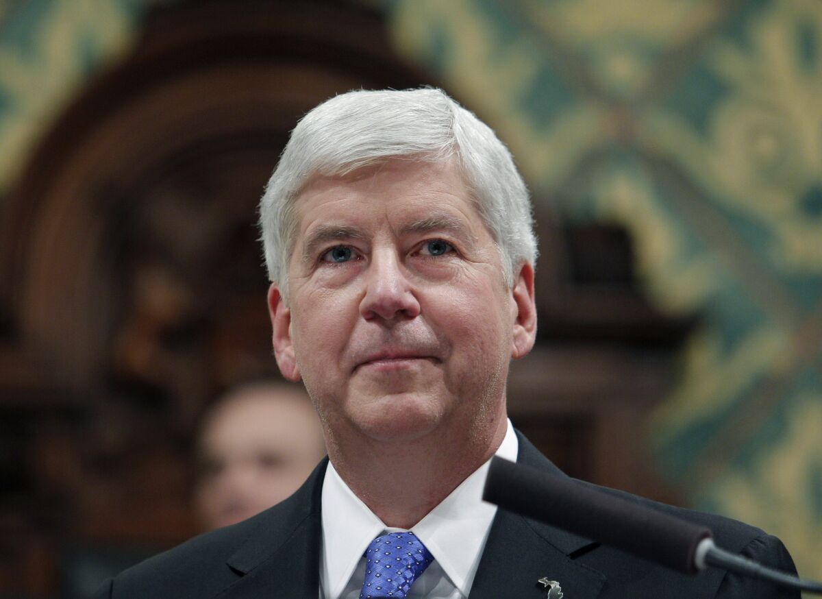 FILE - Former Michigan Gov. Rick Snyder delivers his State of the State address at the state Capitol in Lansing, Mich., on Jan. 23, 2018. A year after unprecedented charges against the former governor, the Flint water prosecution of Snyder and eight others is moving slowly, bogged down by disputes over millions of documents and even whether some cases were filed in the proper court. (AP Photo/Al Goldis, File)