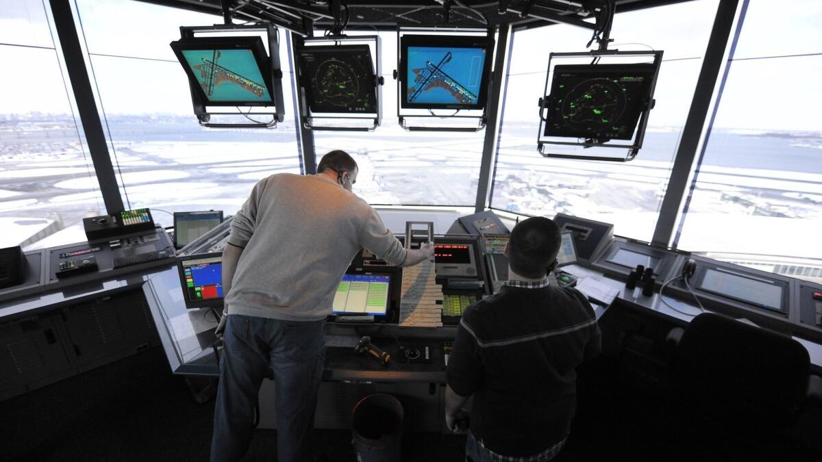 Air-traffic controllers work at LaGuardia Airport in New York in 2011.