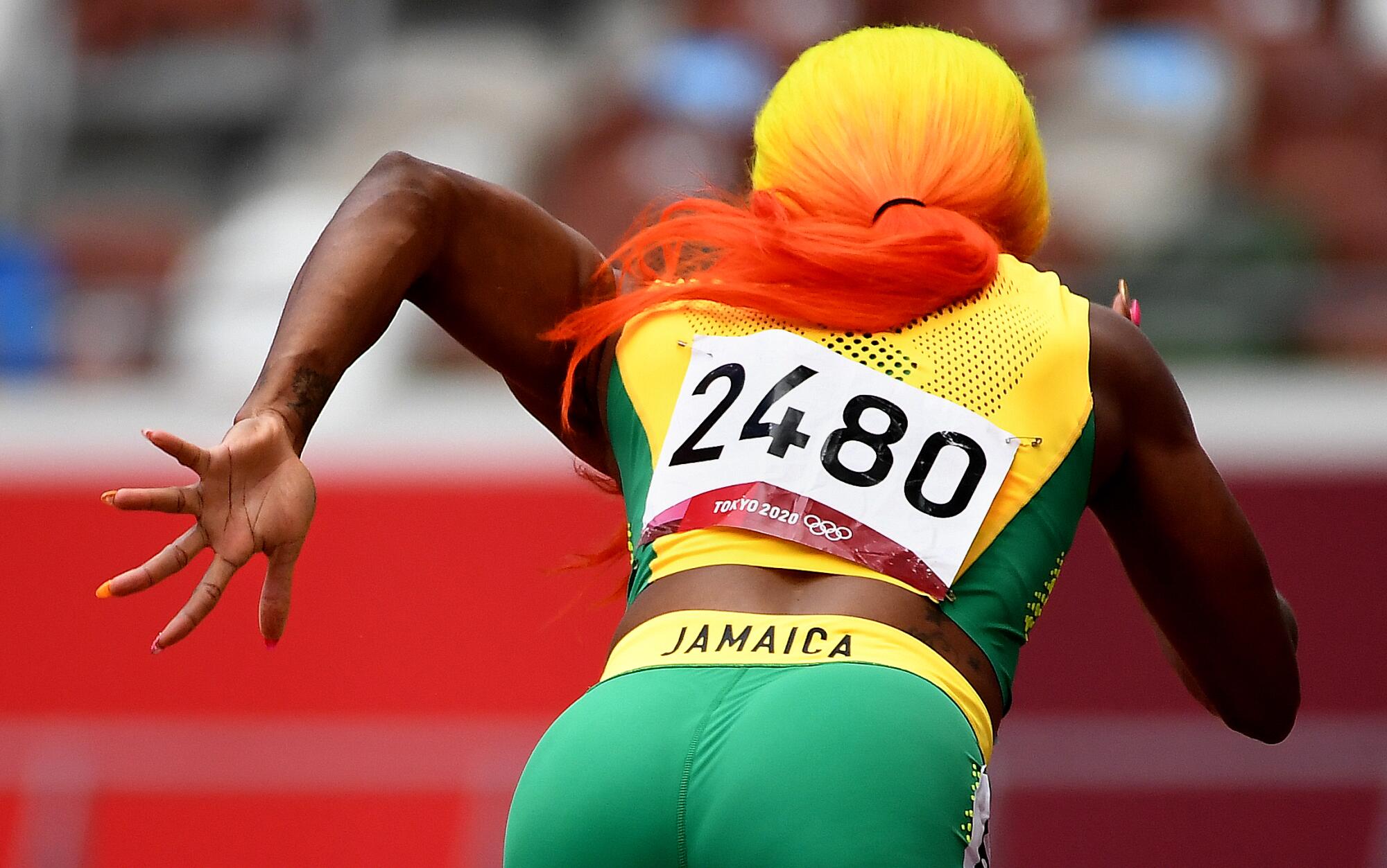Jamaica's Shelly-Ann Fraser-Pryce takes off from the starting blocks in round 1 of the 200m race.