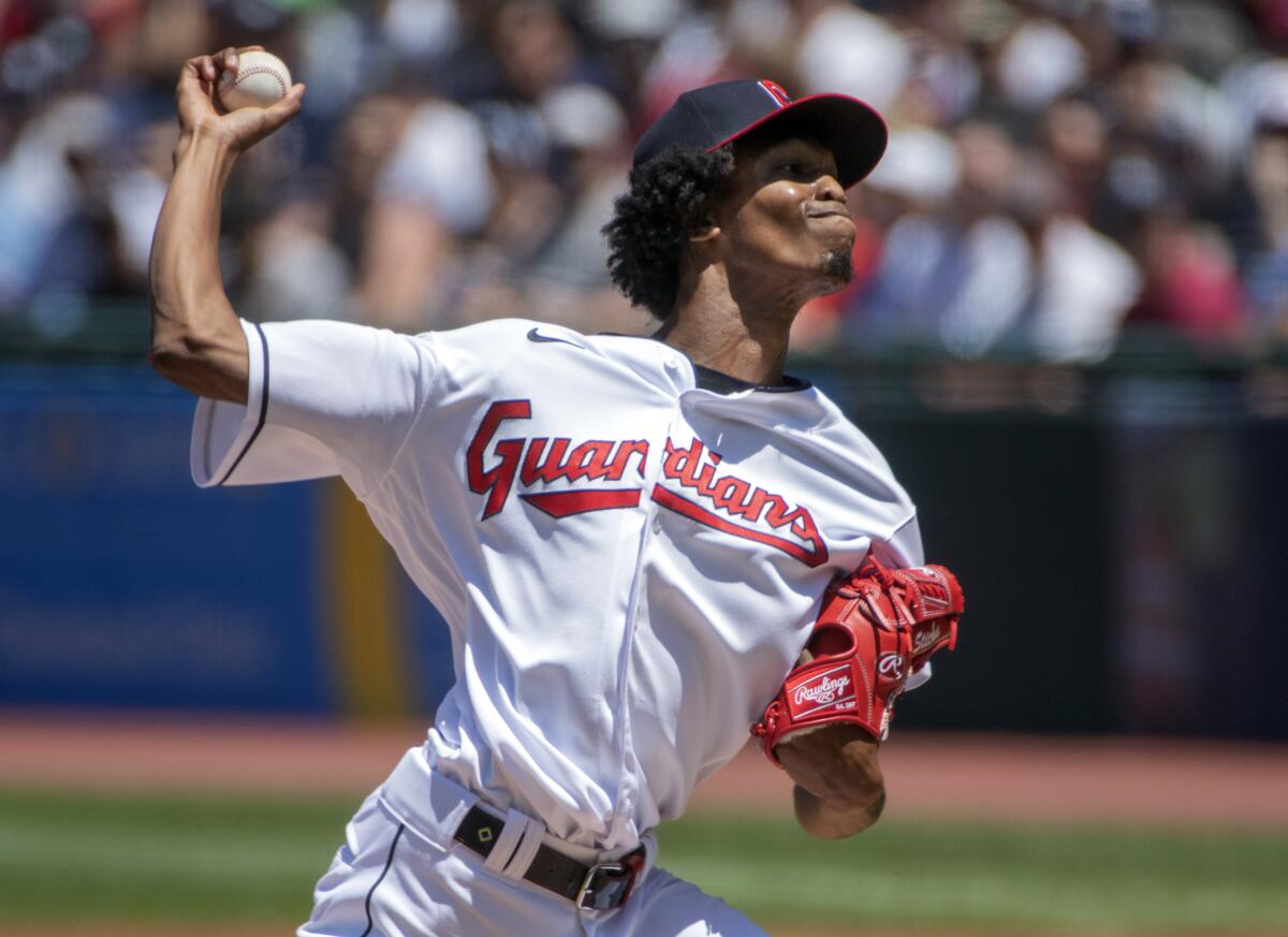 Cleveland Guardians starting pitcher Triston McKenzie delivers against the New York Yankees during the first inning of a baseball game in Cleveland, Sunday, July 3, 2022. (AP Photo/Phil Long)