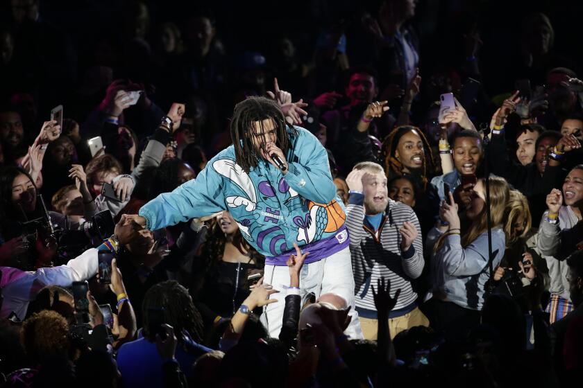 Rapper J. Cole performs at halftime of the NBA All-Star game.