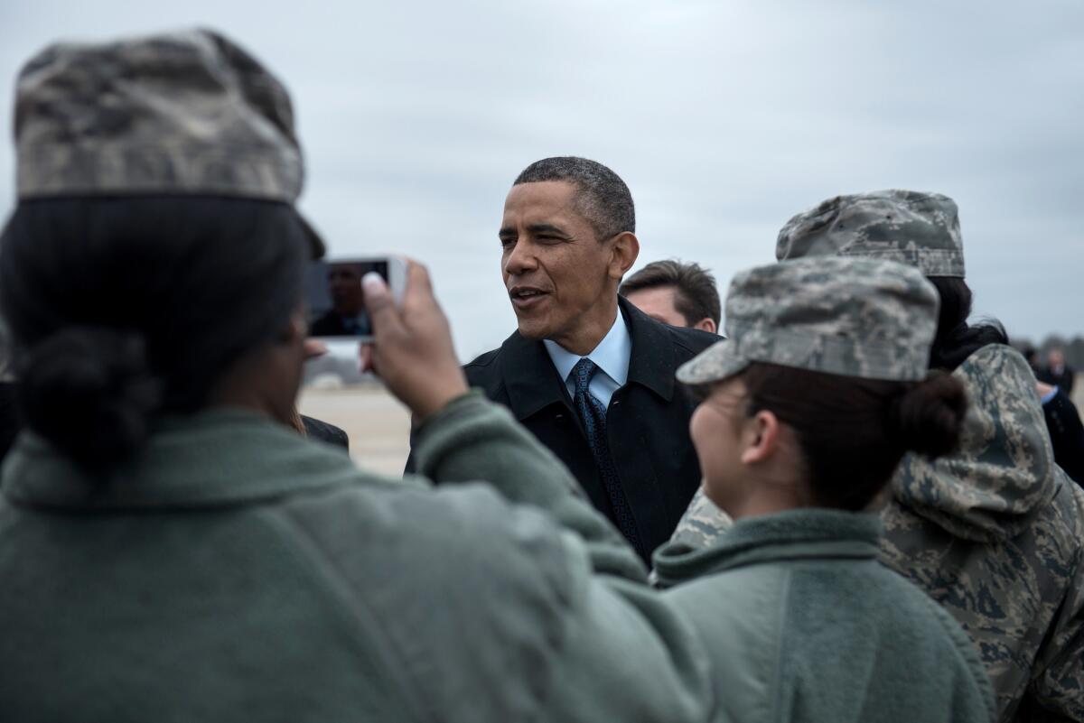 President Obama greets service members after arriving at Joint Base Langley-Eustis in Virginia.